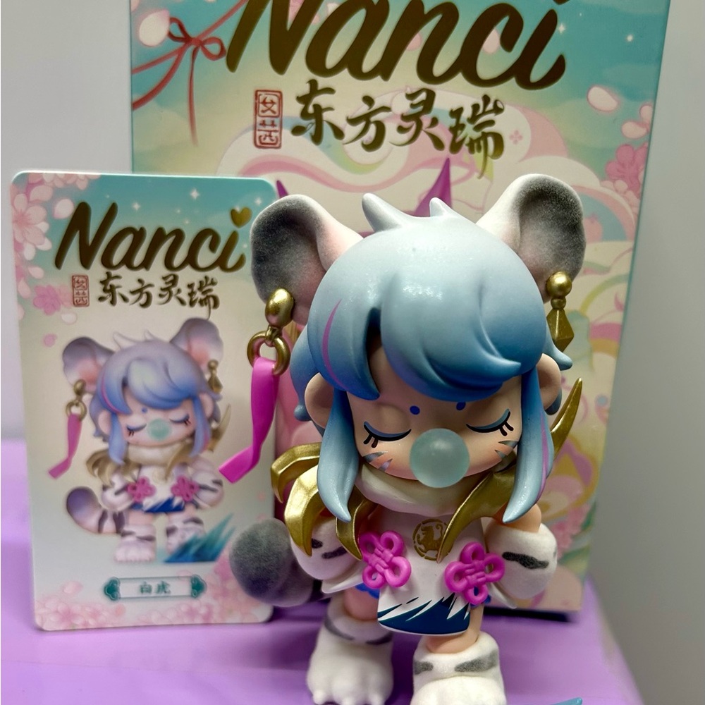 Nanci Figurine with Blue and Pink Accents